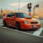 A Red Subaru Impreza on a Street