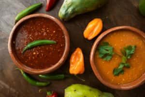 Red and Orange Soup in a Bowl on the Wooden Table Top