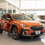 A Orange Subaru Outback inside a dealership