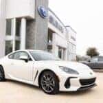 White BRZ parked in front of Huffines Subaru Corinth