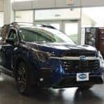 A blue Subaru Ascent parked inside Huffines Subaru Corinth