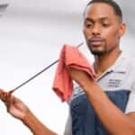 Mechanic in Oconomowoc, WI checking the oil in a Hyundai vehicle