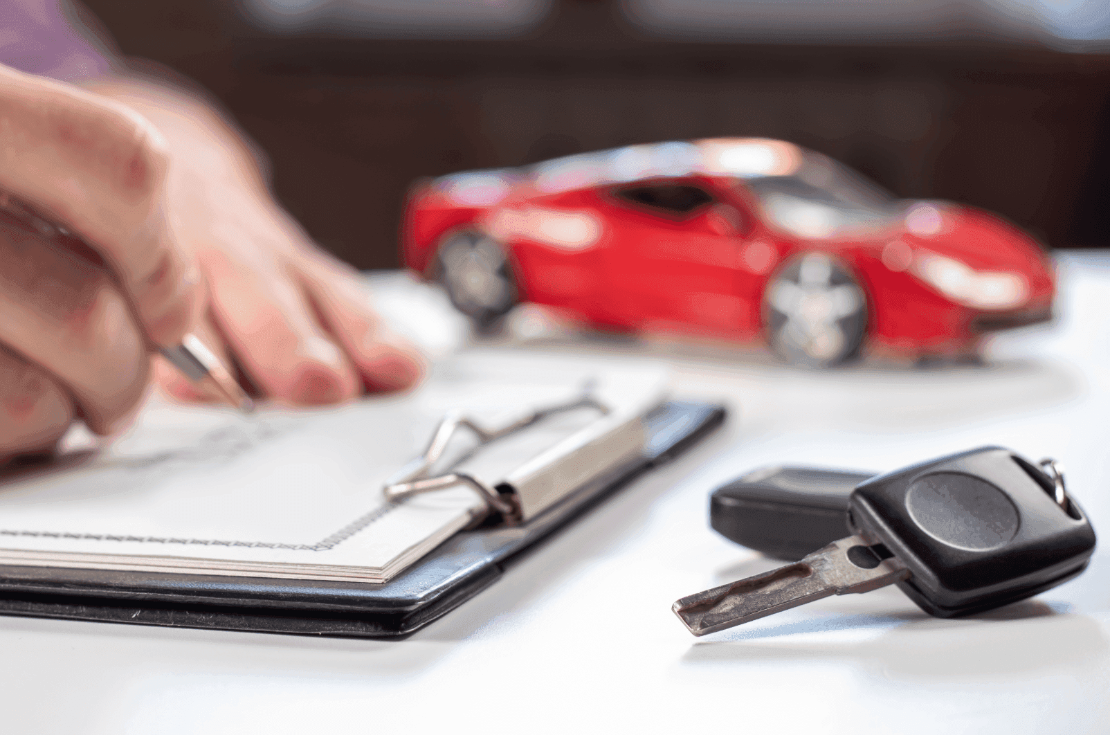 Contract getting signed at a car dealership