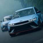 Two light blue 2026 Hyundai Ioniq 5 N sedans driving down a misty road