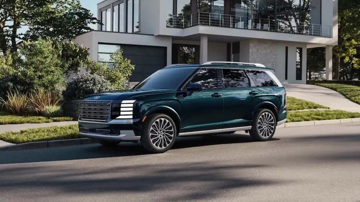 A dark green 2027 Hyundai Palisade SUV parked at a curb outside a house