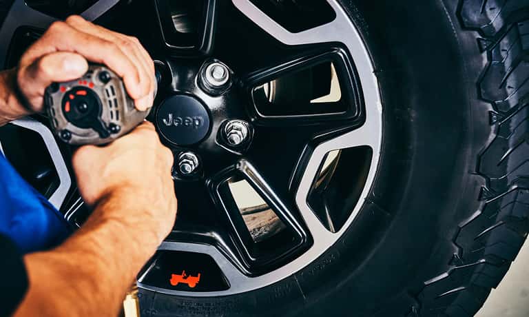 Technician changing a tire