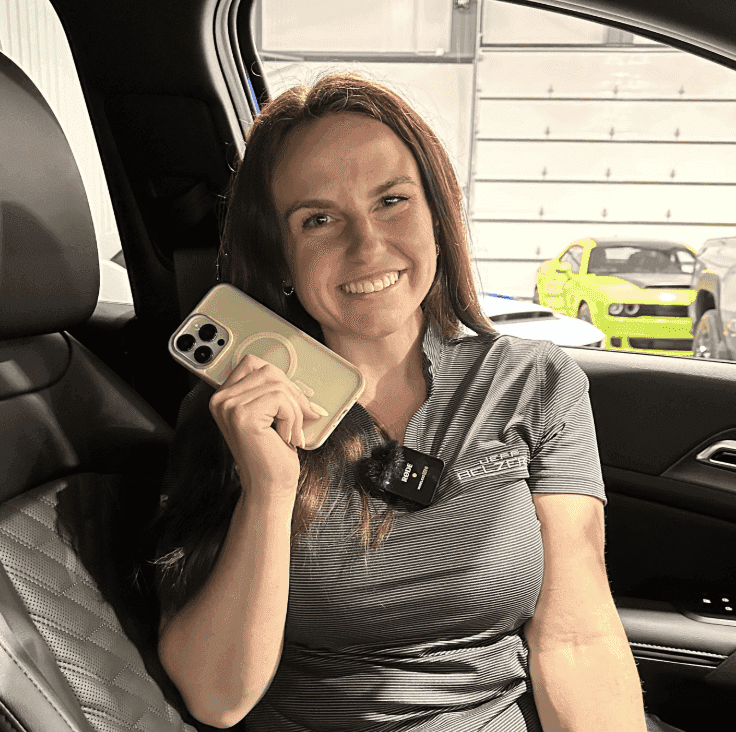 Allye holding her phone in the 2026 Kia Sportage
