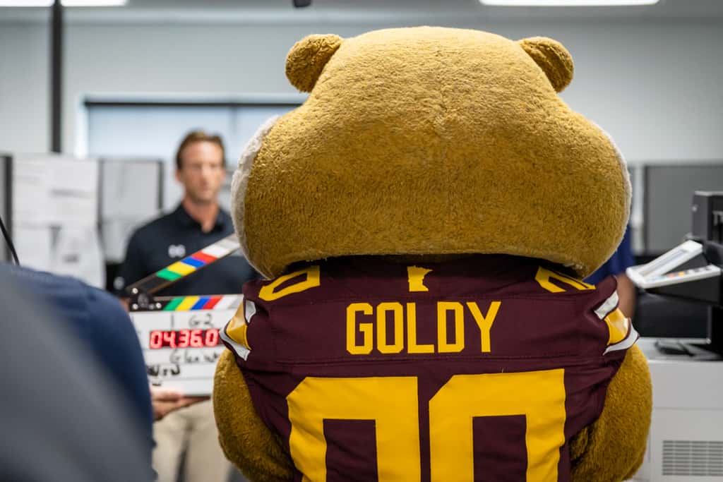 Gopher Athletics staff on a baseball field