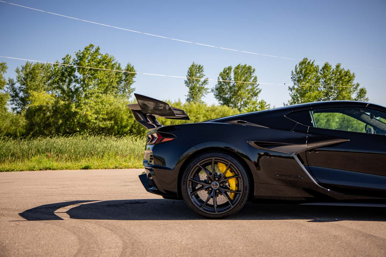 2027 Corvette ZR1X side profile showing the rear spoiler