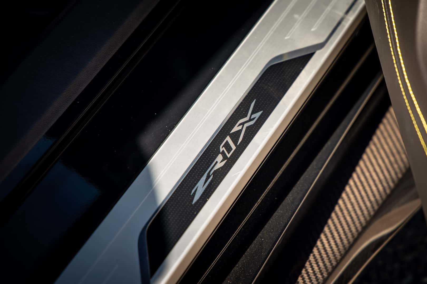 2027 Corvette ZR1X emblem in the door sill