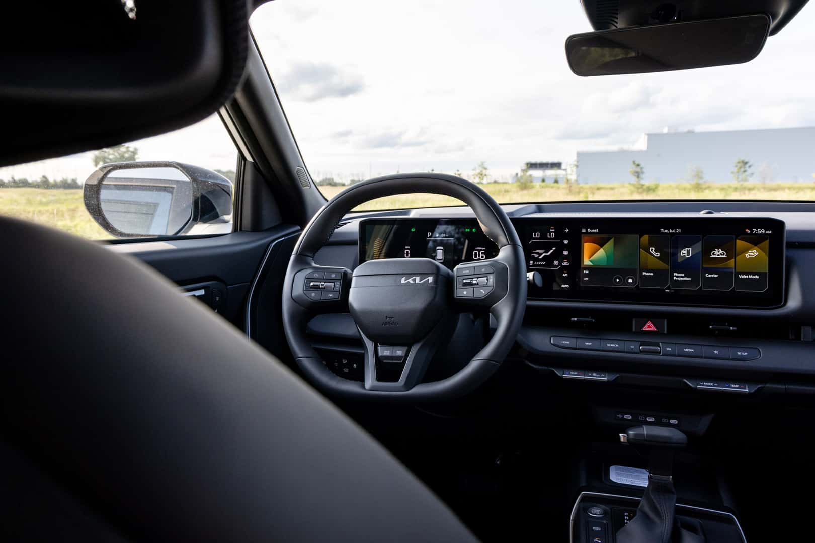 2027 Kia Seltos steering wheel and dual-screen infotainment display