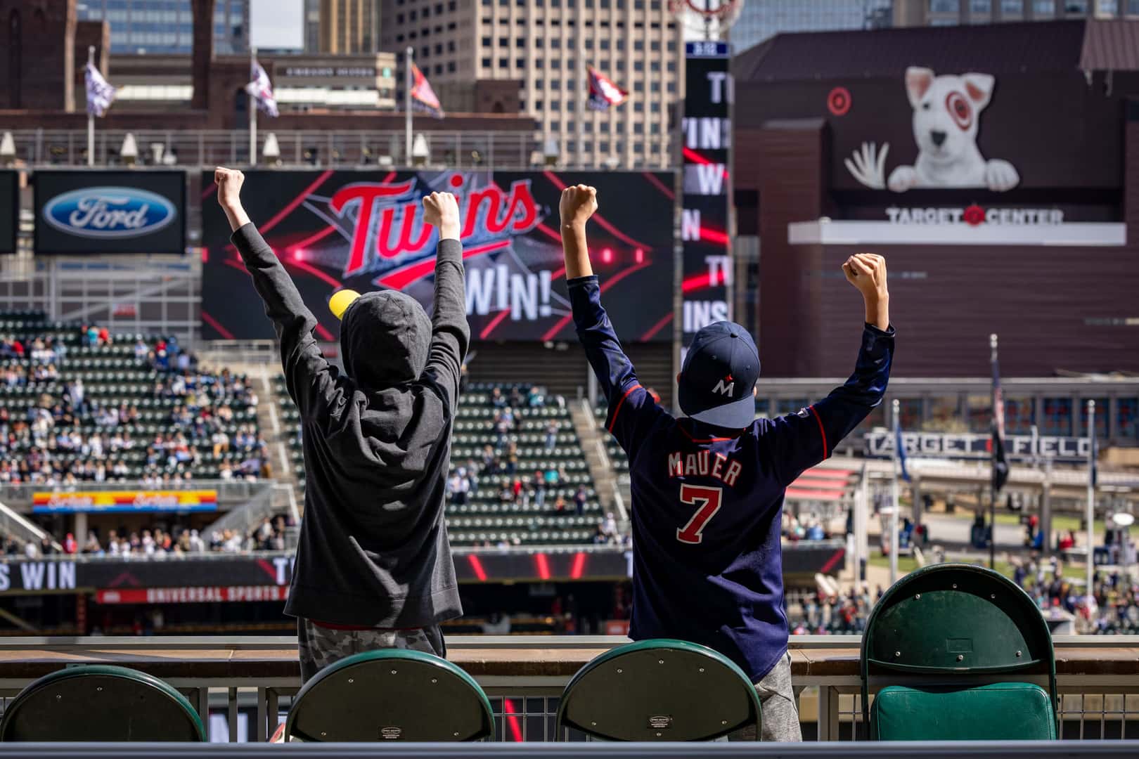 Kids cheer in the stands after the Minnesota Twins walk-off hit at Target Field