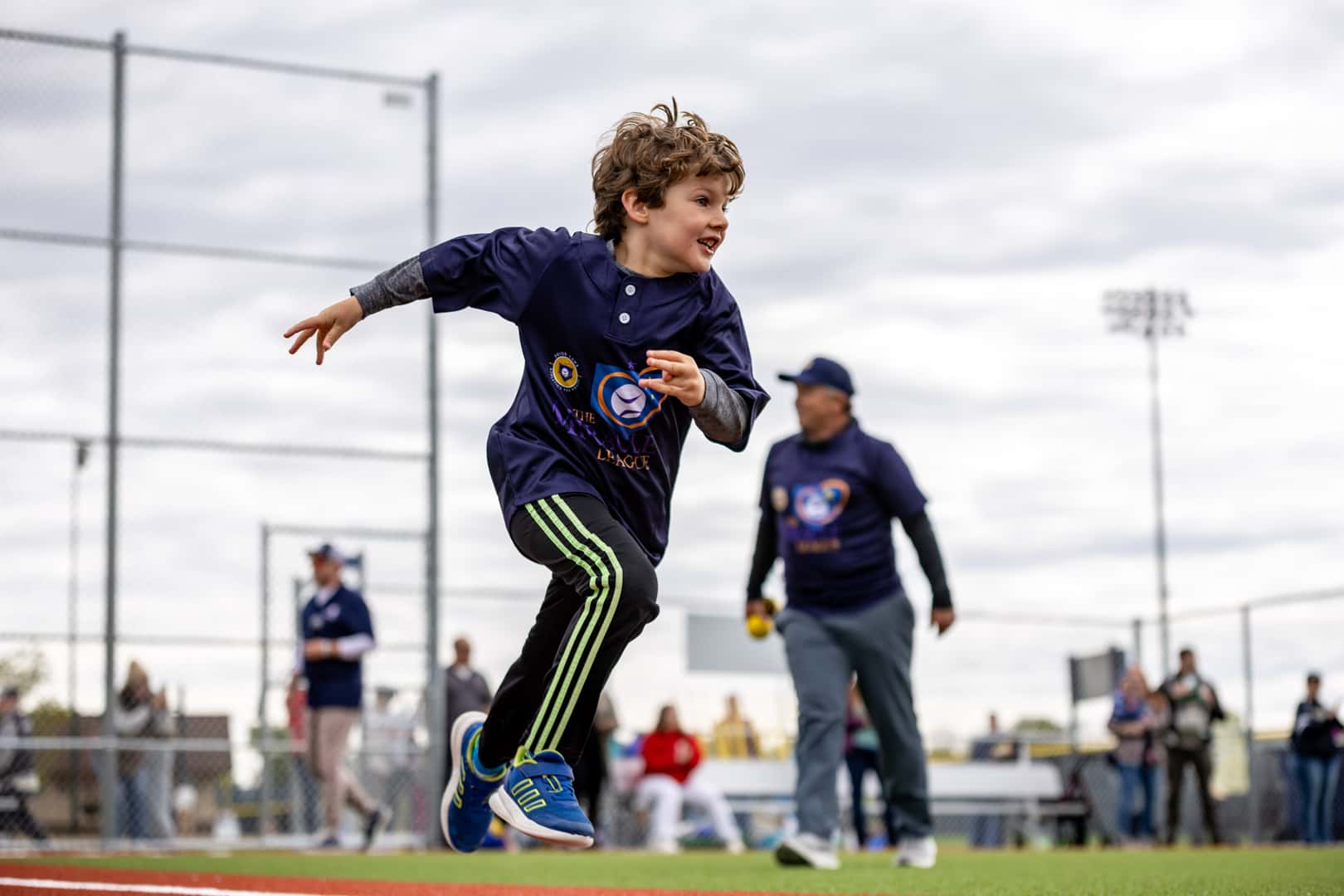 Miracle League athlete and buddy together during the Prior Lake opening-day game