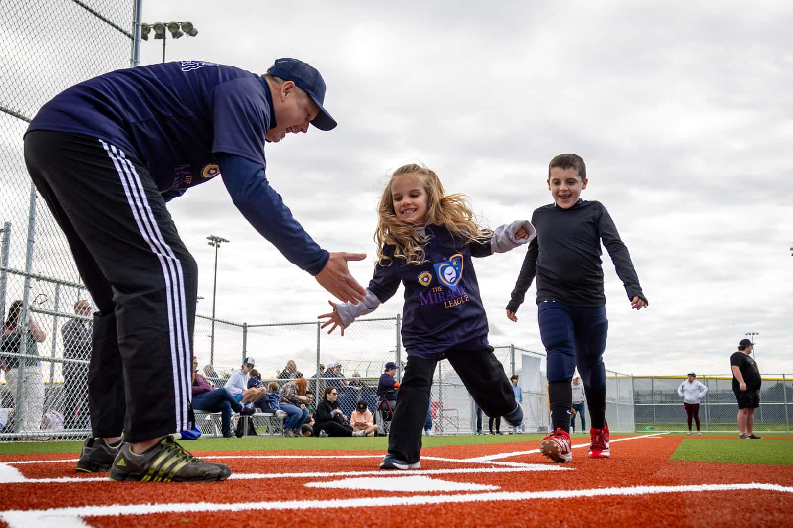 Athlete participating in opening-day activities at the Prior Lake Miracle League Field