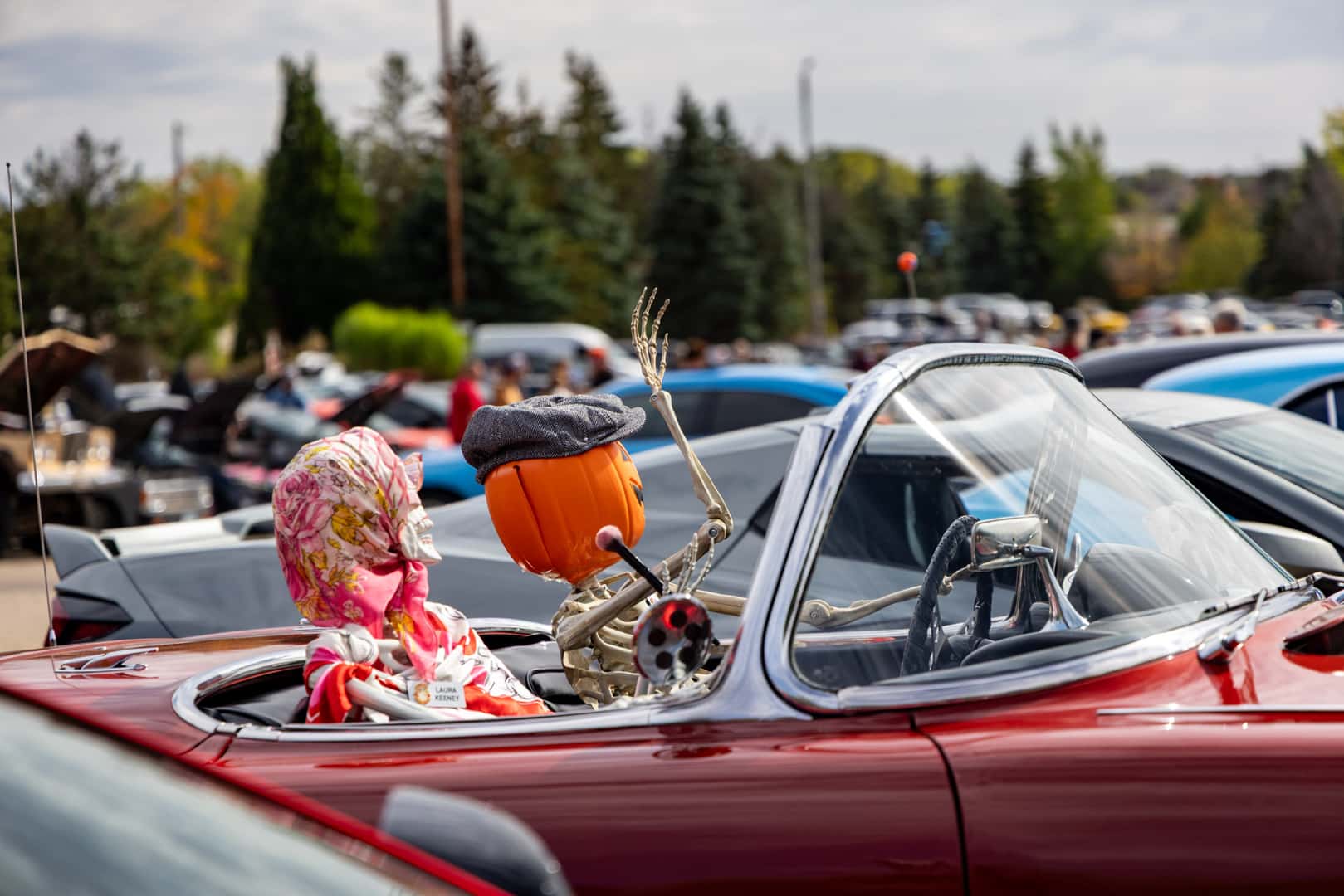 Pumpkin-headed skeletons sitting in a car at the 2026 Bucktoberfest Car Show