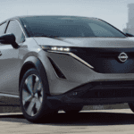 2025 Nissan Ariya in grey driving in city