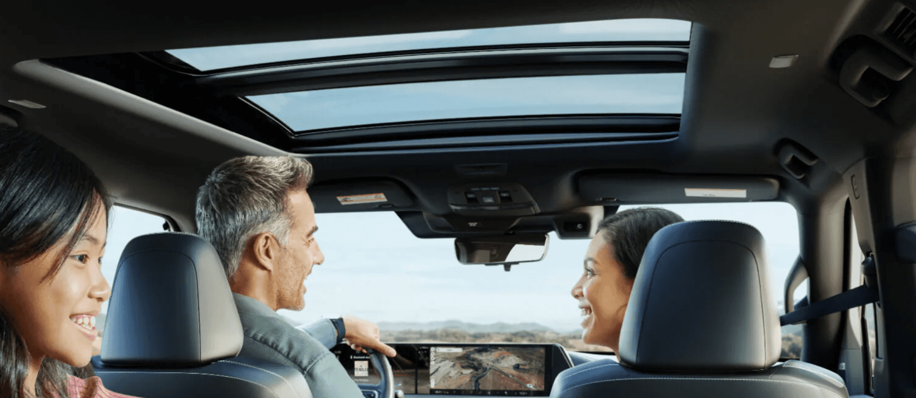 Family driving in a Nissan