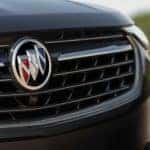 A close up shows the grille on a black 2023 Buick Envision ST.