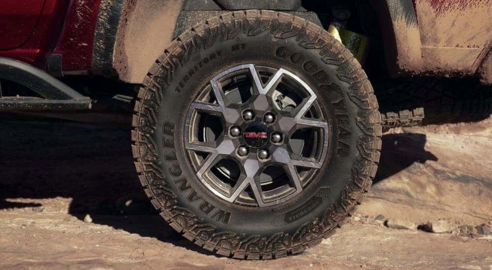 A close up shows the wheel and tire on a 2023 GMC Canyon AT4X after leaving a GMC dealer in Atlanta.