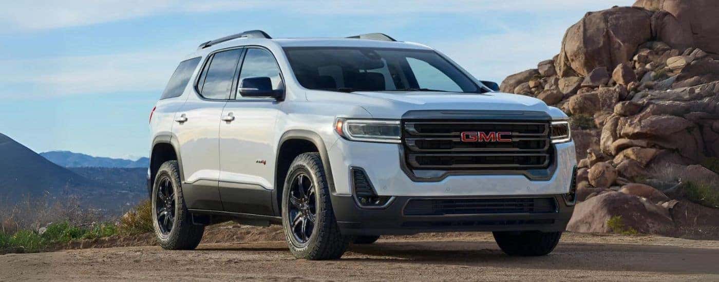 A white 2022 GMC Acadia is shown from the front after leaving a used GMC dealer in Atlanta.