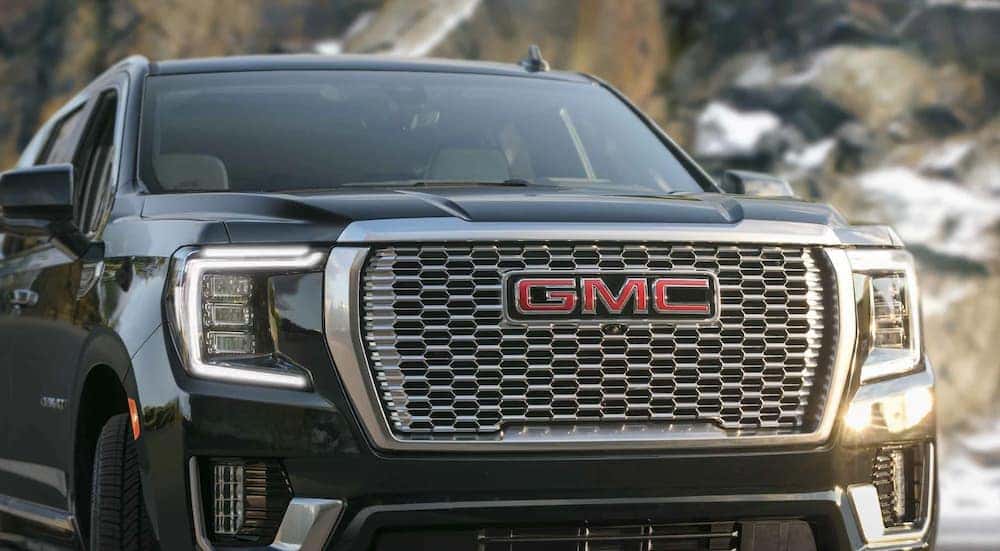 A black 2022 GMC Yukon XL is shown from the front after leaving a used GMC dealer in Atlanta.