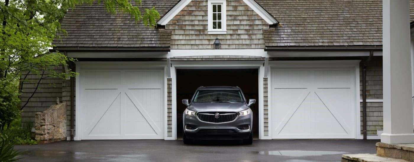 A grey 2019 Buick Enclave is shown in a garage.