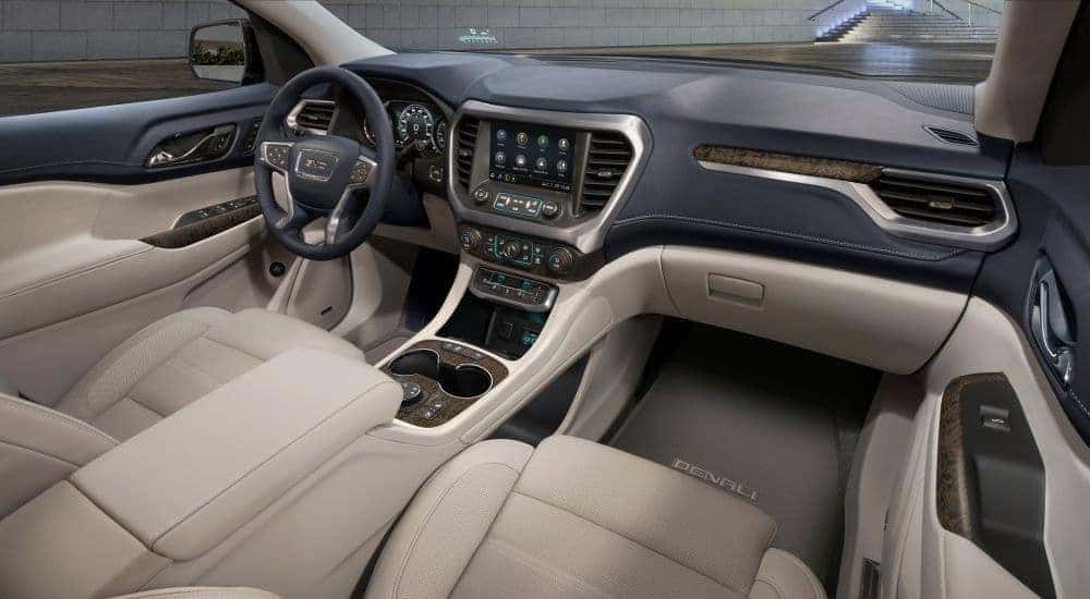 A close up shows the black and tan interior in a 2020 GMC Acadia for sale.