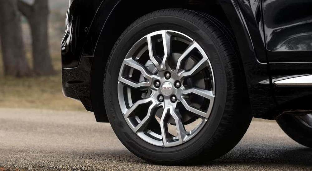 A close-up of a wheel on a 2024 GMC Terrain Denali is shown.