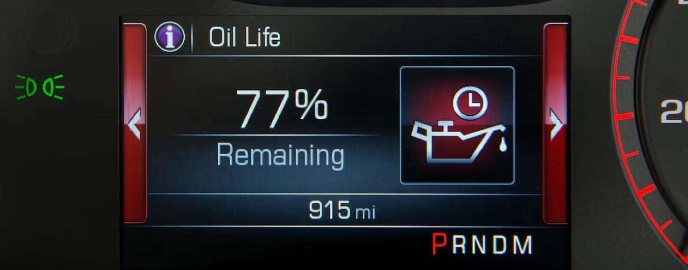 A close-up of the oil life monitor on a GMC digital instrument cluster.