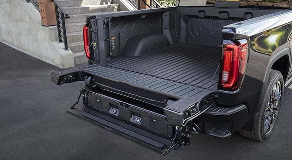 The MultiPro Tailgate on a black 2024 GMC Sierra 1500 Denali is shown.