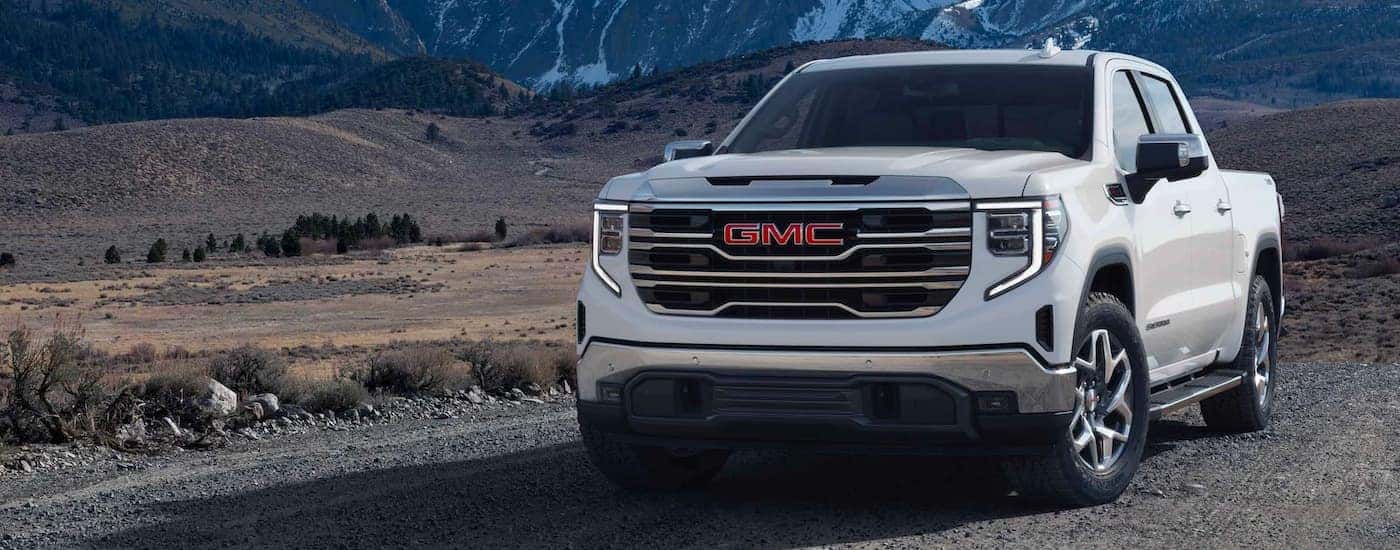 A white 2024 GMC Sierra 1500 parked off-road.