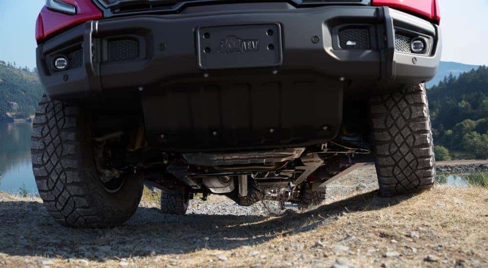 A close-up shows the ground clearance on a 2023 GMC Sierra 1500 for sale near Sandy Springs.