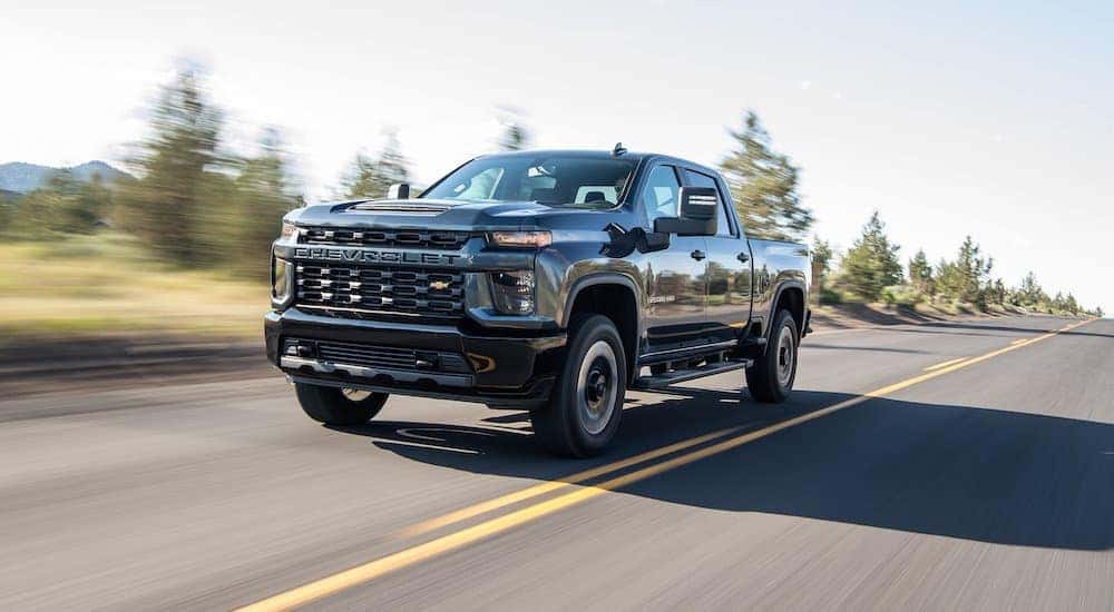 A black 2020 Chevy Silverado 2500 HD driving.