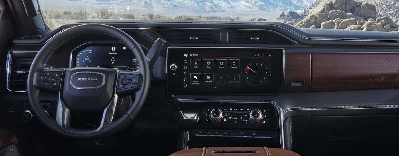 The black and brown dash is shown in a 2024 GMC Sierra 2500 Denali.
