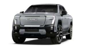 A silver 2025 GMC Sierra EV is facing left.