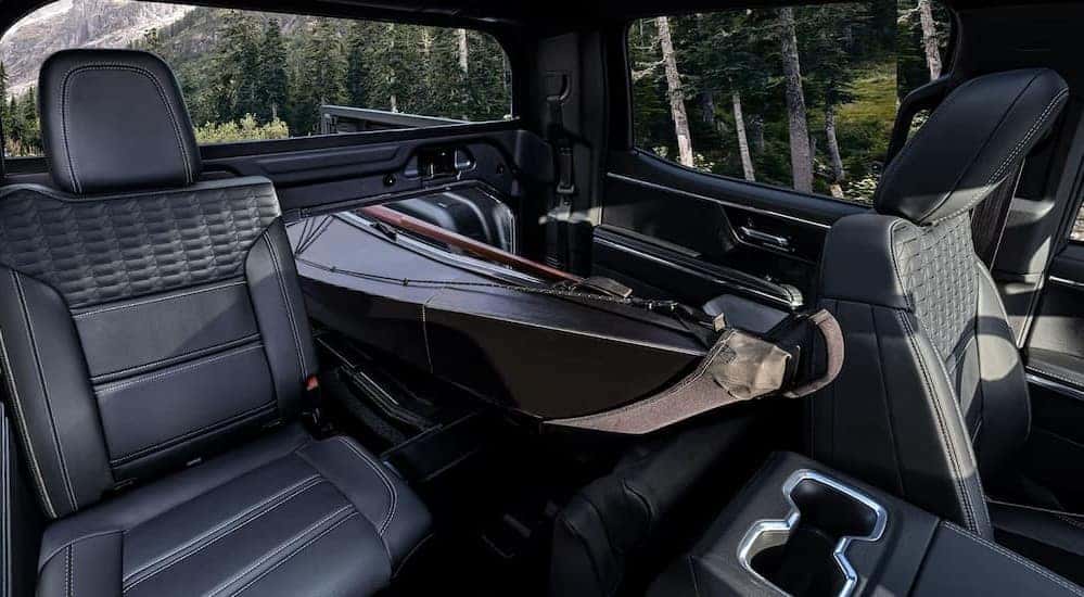 The black interior is shown in a 2025 GMC Sierra EV.