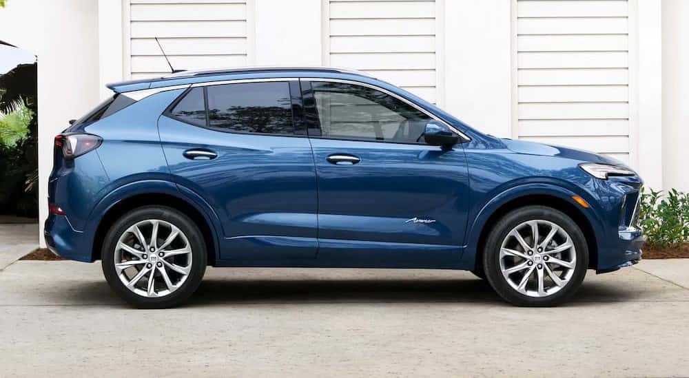 A blue 2025 Buick Encore GX Avenir is shown parked on a driveway.