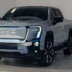 Grey 2024 GMC Sierra EV charging