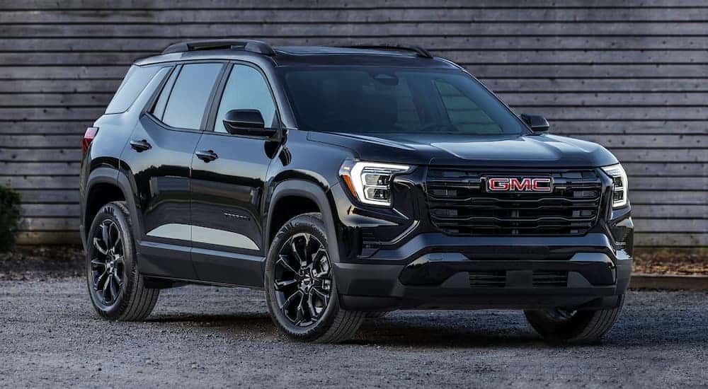 A black 2025 GMC Terrain parked off-road and angled right after visiting a GMC dealer near Alpharetta.