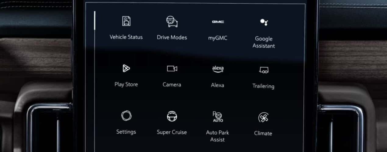 A close-up shows apps on the infotainment screen in a 2025 GMC Yukon.