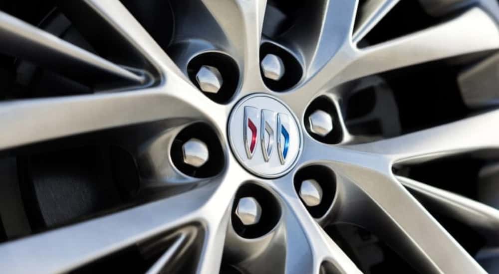 A close up shows a silver wheel on a 2025 Buick Enclave.