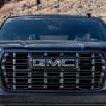 Close-up of the grille on a black 2025 GMC Yukon XL.