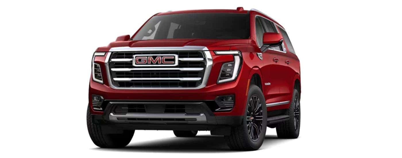 A red 2025 GMC Yukon XL angled left.