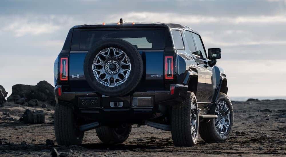 The rear-end of a black 2025 GMC Hummer EV SUV.