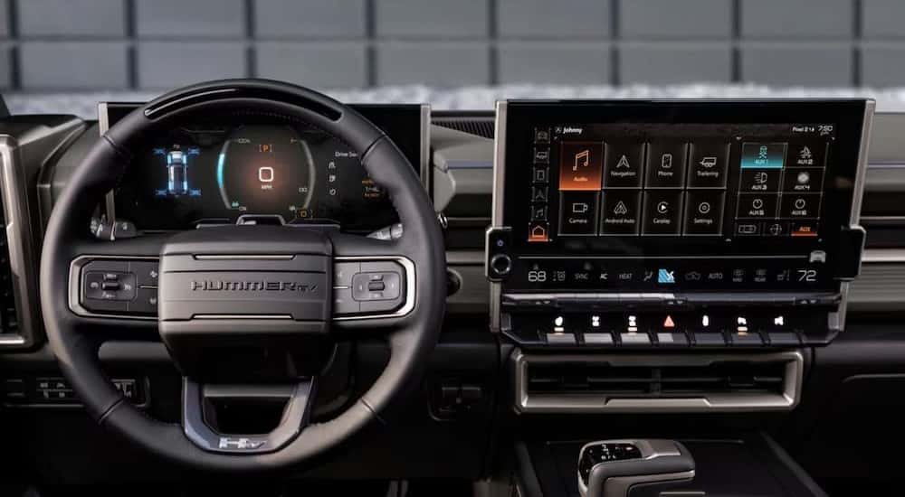 Steering wheel and infotainment screen in a 2025 GMC Hummer EV for sale.