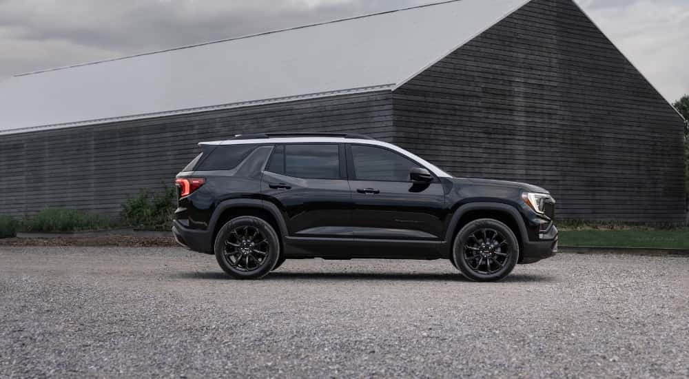 A black 2025 GMC Terrain for sale from the side.