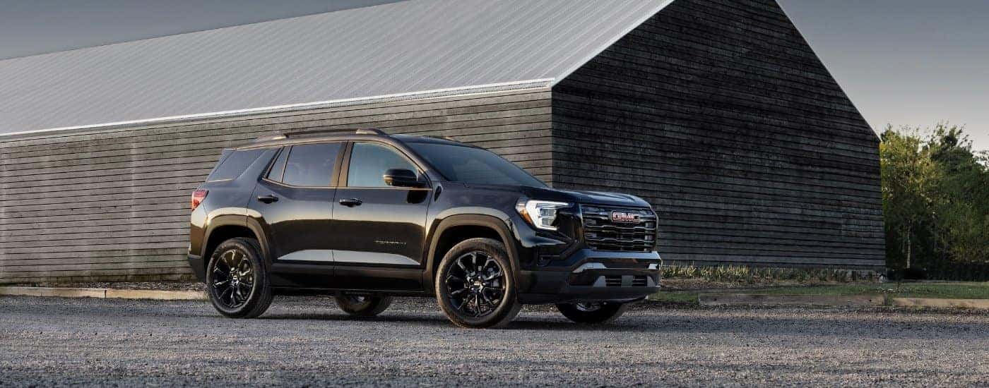 A black 2025 GMC Terrain for sale from the side.