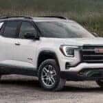 White 2026 GMC Terrain AT4 for sale parked off-road.