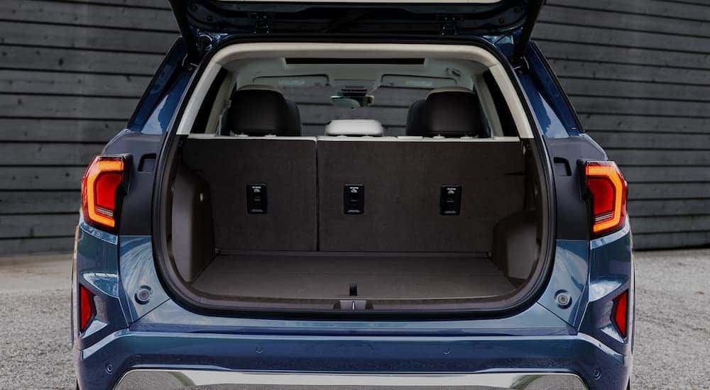 Close-up on the rear of a blue 2026 GMC Terrain with an hatch.