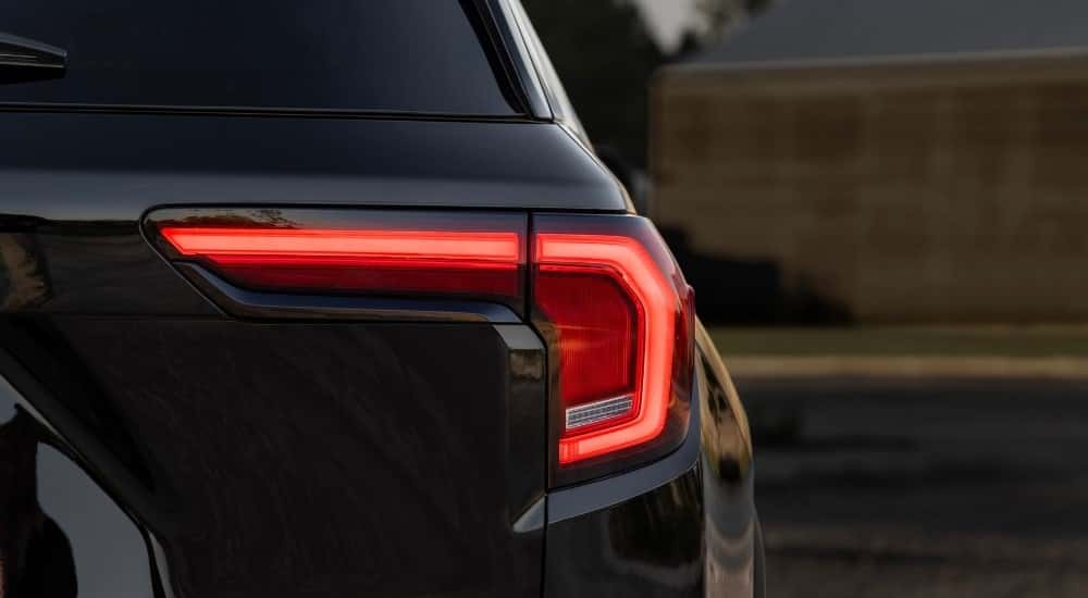 The taillight of a black 2025 GMC Terrain.